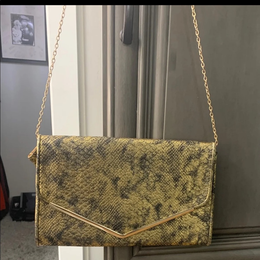 Gold and black snakeskin oversized clutch